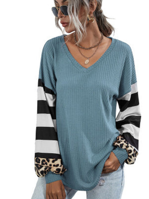 Sky blue waffle knit top with colorblock striped and leopard print sleeves