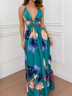 Teal floral maxi dress with cutout sides, deep V-neck and decorative ring detail.