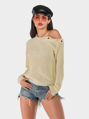 Beige knit sweater with button detail on shoulder, off-shoulder style, long sleeves.
