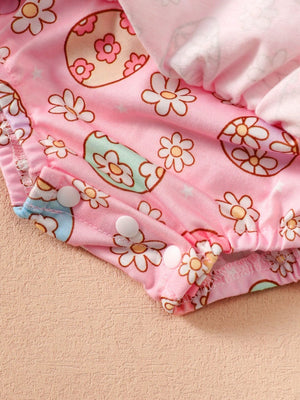 Pink cotton bodysuit with floral print and snap closures