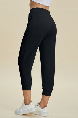 Black joggers with drawstring waist and cuffed ankles