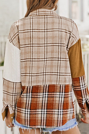 Patchwork plaid shacket with mixed textures and colors, featuring a button front and casual cut.