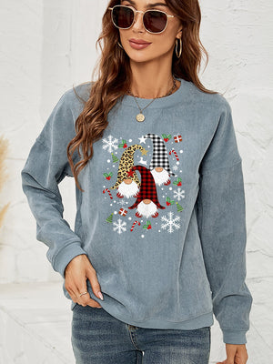 Light Blue corduroy sweatshirt with a gnome graphic featuring plaid and leopard patterns, snowflakes, and candy canes.