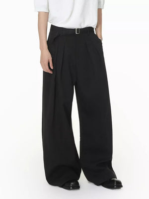 Black wide-leg pleated sweatpants with a belt and contemporary fit.