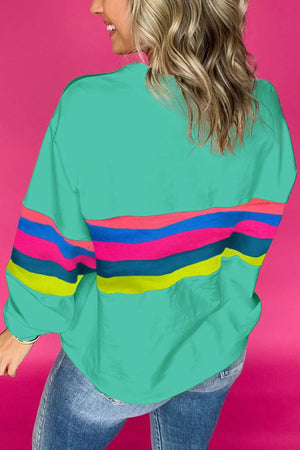 Turquoise crewneck sweatshirt with colorful horizontal stripes on sleeves and torso.