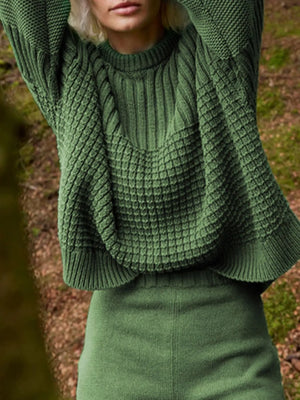 Moss green textured knit pullover sweater with round neck and mixed stitch patterns.