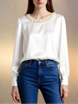White satin blouse with pearl trim neckline and long sleeves