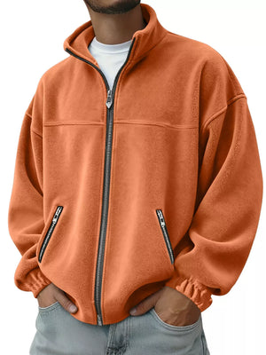 Orange fleece zip-up jacket with zippered pockets and mock neck