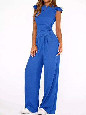 Sky blue ruffled cap sleeve maternity one-piece with ruched waist and wide-leg pants.