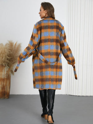 Belted bouclé overcoat with plaid pattern in brown and blue, featuring a tie waist.