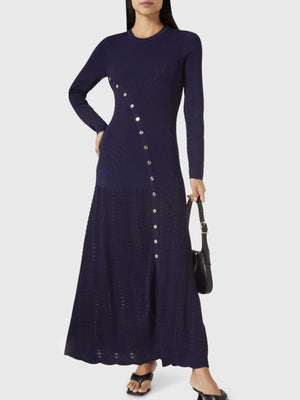 Dark blue ribbed knit maxi dress with decorative buttons and a side slit.