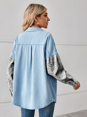 Light denim overshirt with leopard print sleeves and button front.
