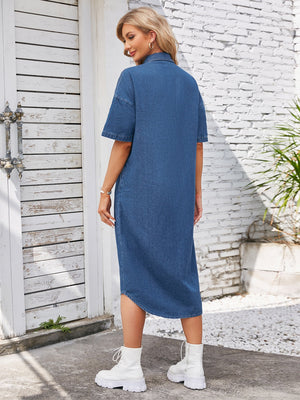 Denim shirtdress in dusty blue with short sleeves and an asymmetric hemline.