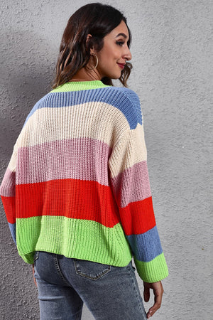 Rainbow block button-down knit cardigan in acrylic with bold stripes of neon green, red, pink, cream, and blue.