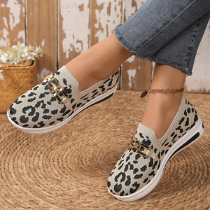 Leopard print mesh slip-on shoes with gold buckle detail.