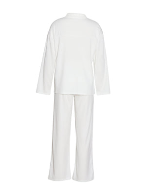 White ribbed knit lounge set with relaxed fit top and wide leg pants