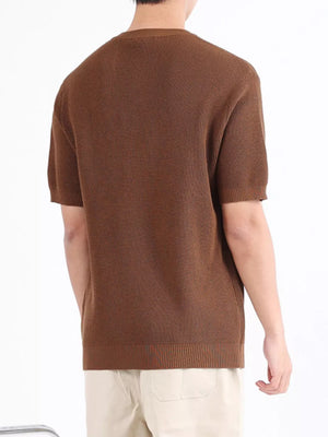Brown textured knit henley shirt with short sleeves and ribbed hem.