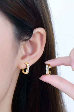 Gold square pavé moissanite hoop earrings with clear stones.