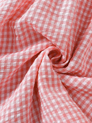 Children's Smocked Plaid Ruffle Sleeve Dress in Pink, back view