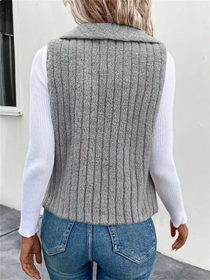 Textured teddy collarless vest in gray with vertical ribbing detail.