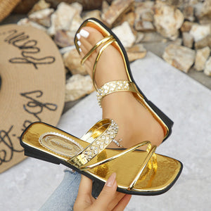 Gold rhinestone-studded square toe flat sandals with thin straps.