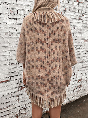Textured fringe shawl cardigan in camel with a geometric pattern and fringed hem and neckline.