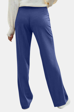 Button detail wide leg trousers in Dusty Blue, shown from the back.