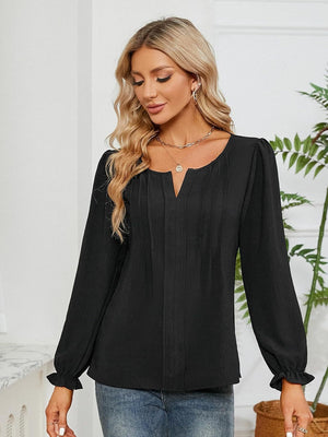 Black textured pleat-front blouse with V-neck and ruffle cuffs
