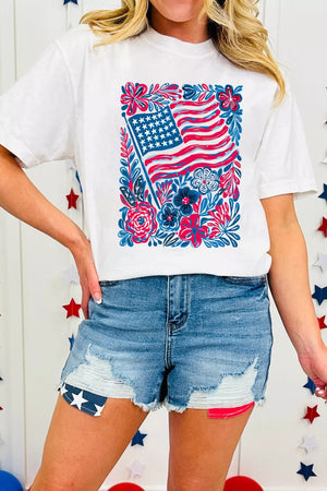 White graphic t-shirt with patriotic floral flag print, crew neck, short sleeves.