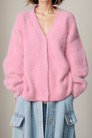 Fluffy angora V-neck cardigan in blush pink with button front and relaxed fit.