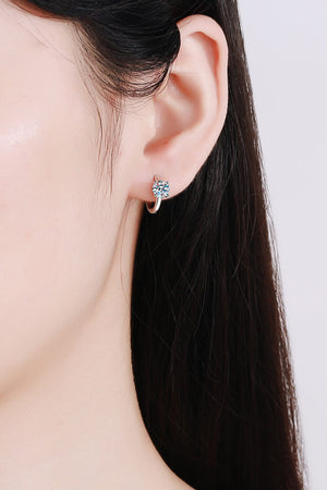 Silver solitaire halo hoop earrings with a single sparkling stone.