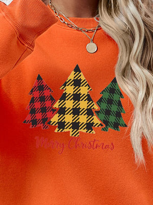 Orange crewneck sweatshirt with plaid trees graphic and Merry Christmas text.