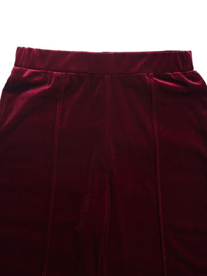 Burgundy velvet palazzo trousers with seam detail and elastic waistband.