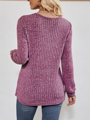 Textured ribbed V-neck pullover sweater in lilac with long sleeves.