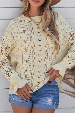 Yellow openwork knit sweater with lace sleeves and textured front detail.