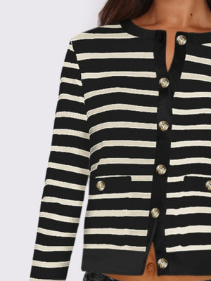 Black and white striped cropped cardigan with gold buttons and pocket details.
