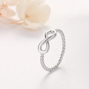 Sterling silver ring with infinity symbol and beaded band