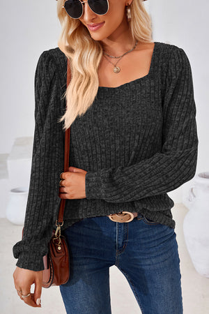 Black ribbed top with square neckline and puffed sleeves