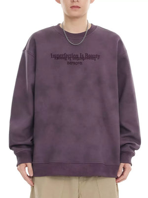 Purple oversized sweatshirt with "Imperfection Is Beauty IMPROVE" graphic print