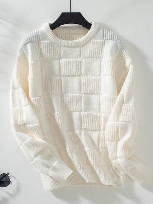 Cream textured checkerboard knit pullover sweater with crewneck and long sleeves.