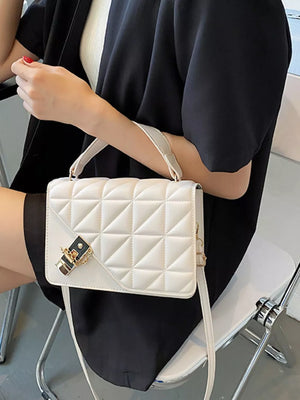 Diamond quilted PU leather crossbody bag in beige white with gold hardware and turn-lock closure.