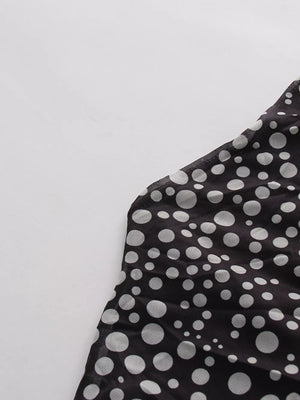 Black mesh maternity maxi dress with white polka dots and halter neckline detail.