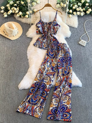 Chic cami and wide-leg pant set with colorful paisley print and spaghetti straps.