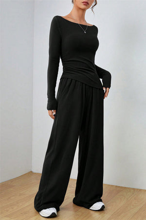 Black boat neck loungewear set with long sleeves and wide-leg pants.