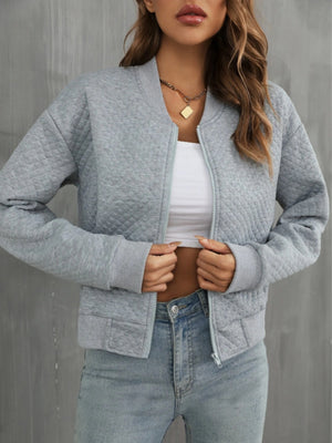 Gray diamond quilted bomber jacket with zip front and ribbed cuffs and hem
