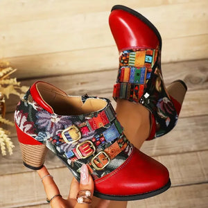 Red ankle boots with floral patchwork and triple buckle detail.
