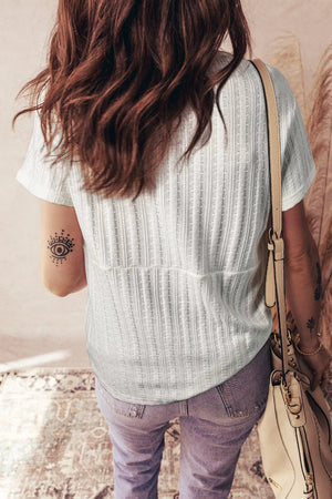 White textured V-neck maternity t-shirt with short sleeves and button details
