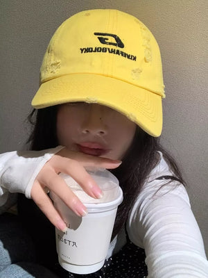 Yellow cotton baseball hat with distressed details and embroidered logo