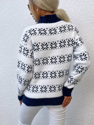 White and navy fair isle mock neck pullover sweater with snowflake pattern.