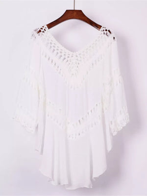 White crochet-trimmed flowy cover-up with V-neck and cutout details.